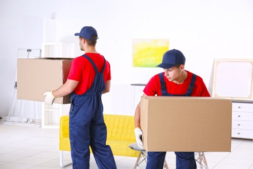 Man and van removals team loading furniture in Finsbury Park