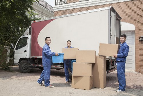 Man and van vehicle loading household items for transport