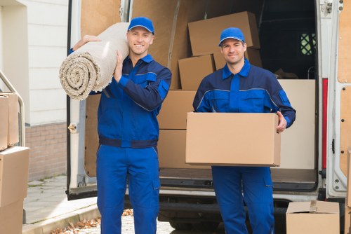 Packed boxes and furniture ready for transport in a North London flat move