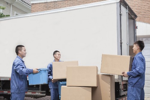 Furniture being loaded carefully into a van for transport