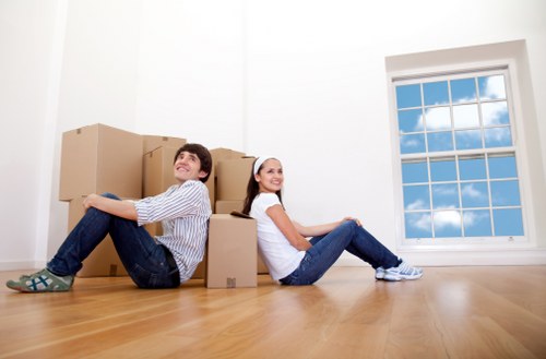 Packed boxes and furniture prepared for a local removals van move