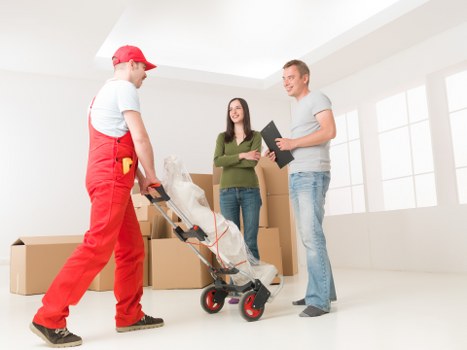 Professional movers loading office items for a Finsbury Park business move