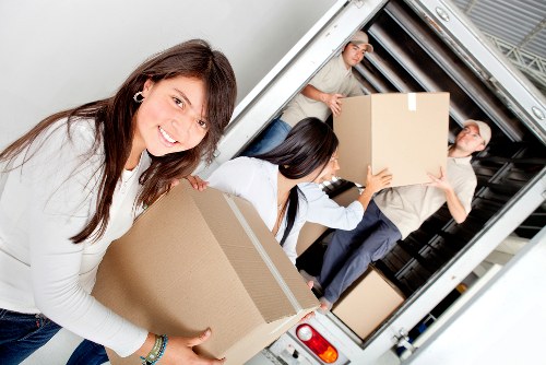 Removalists loading boxes and furniture for a home move in Finsbury Park