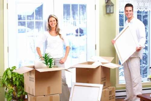 Commercial office moving preparations with labelled boxes and furniture